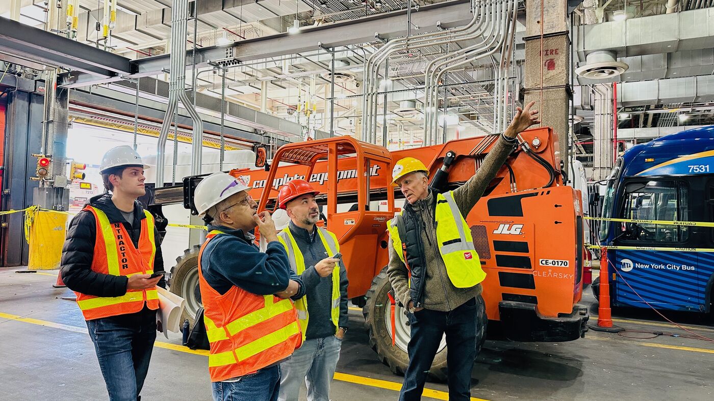 Verdek team reviewing an EV charging depot installation in the field